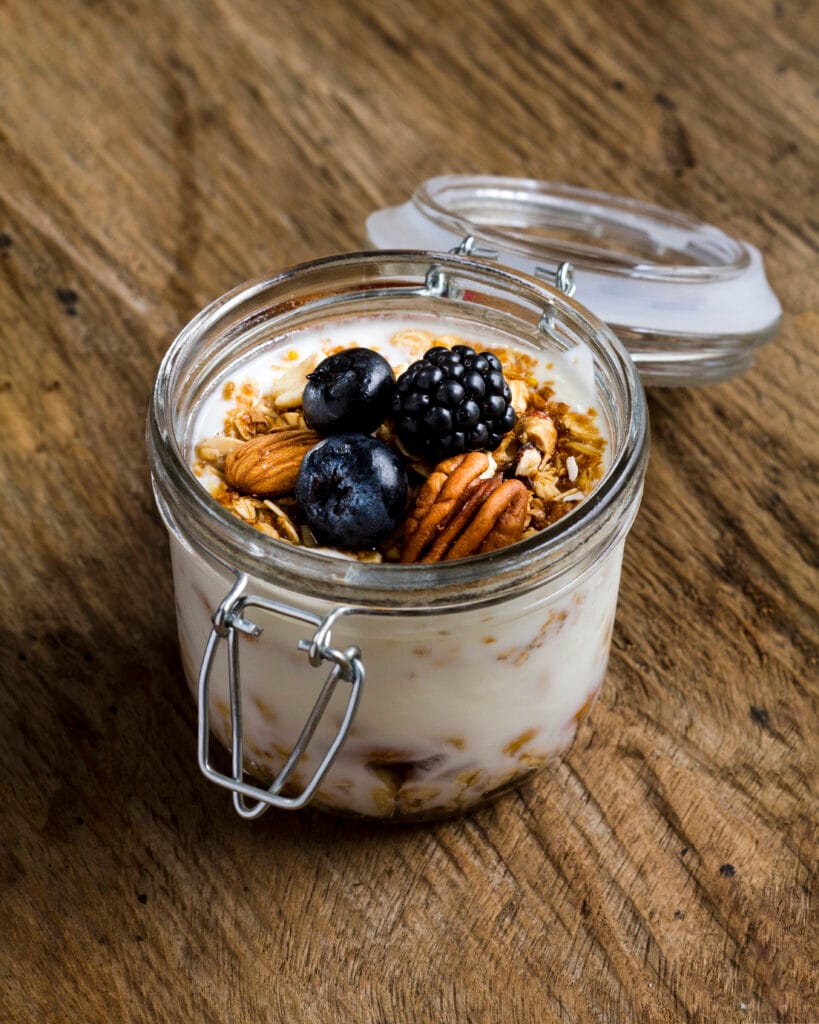 high angle yogurt with black forest fruits nuts